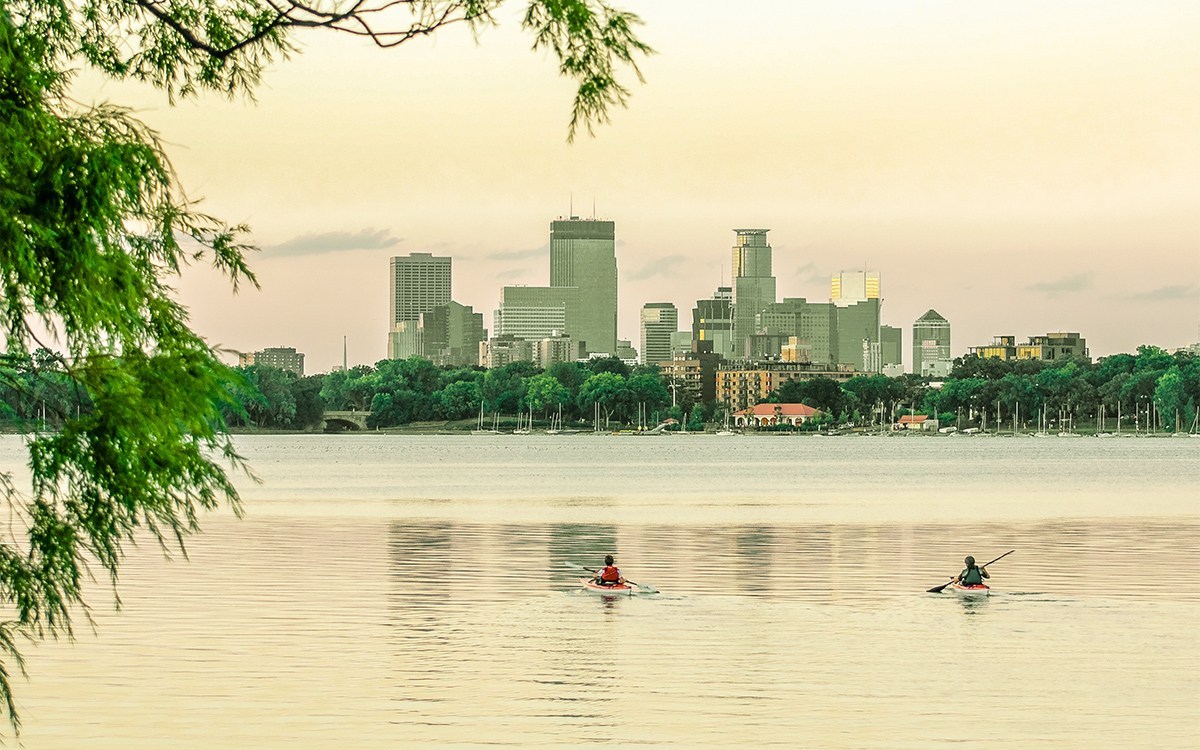 Minneapolis lake with a skyline of the city in the background